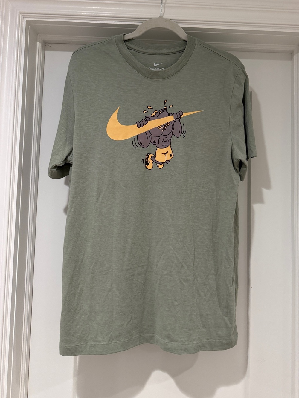 Nike Olive Green Short-Sleeve Tee with Yellow Swoosh Graphic
